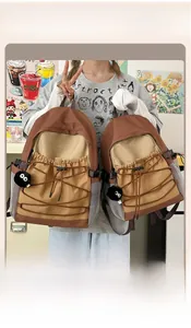 Comparison of large and small size outdoor canvas backpacks in brown and khaki color block