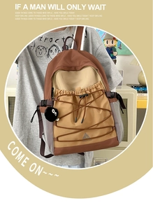 Detail of khaki canvas backpack with contrast stitching and adjustable drawstring system