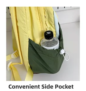 Detail of contrast color nylon backpack featuring adjustable side pocket with drawstring