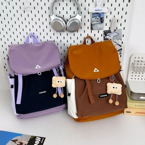 Waterproof nylon backpack for hiking and school with contrast color blocks and cute charms
