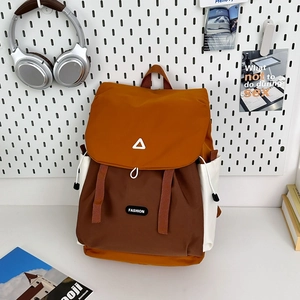 Detail of color-block backpack with waterproof nylon fabric and drawstring closure