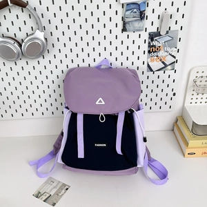 Detail of purple and black contrast backpack with drawstring flap and fashion logo