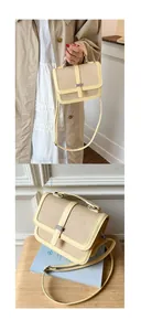 Detail view of a vintage patchwork shoulder bag with cream leather and woven texture