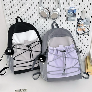 Minimalist canvas backpack with contrast stitching and drawstring for students