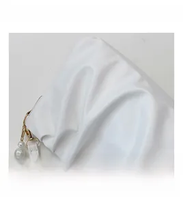 Detail view of white ruched cloud bag with premium pearl chain and pleated texture