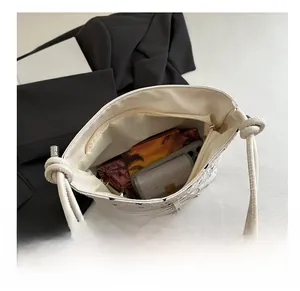Top view of white shoulder bag interior showing spacious capacity for daily essentials