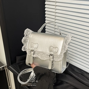 Silver metallic leather handbag with lace trim and bow accents for women