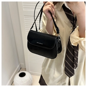 Close-up of black PU leather shoulder bag with FANYISSA & BAG logo and magnetic flap