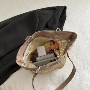 Handwoven straw tote bag with leather trim showing large capacity for daily essentials