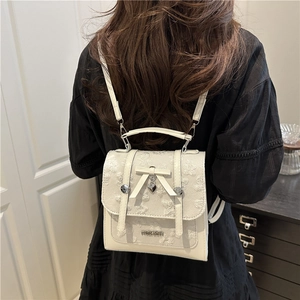 Chic cream mini backpack with floral lace embroidery and a bow heart pendant