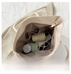 Top view showing large interior capacity of beige crocodile pattern tote bag for daily essentials