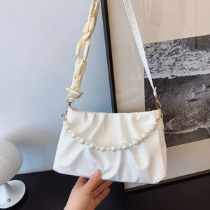 White pleated cloud shoulder bag featuring pearl handle and satin ribbon strap