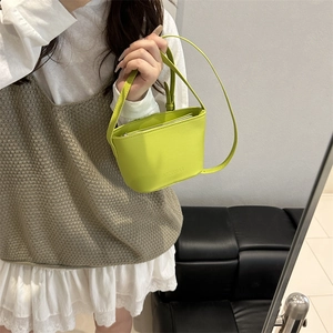 Fluorescent green bucket shoulder bag in matte faux leather with slim strap for women