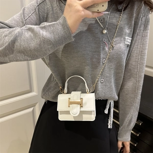 Mini white textured PU leather crossbody bag with gold chain strap and top handle