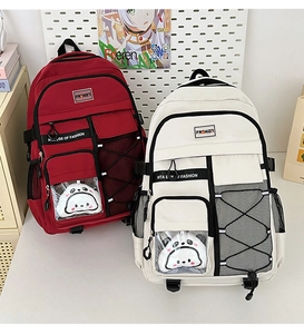 Détail de sacs à dos scolaires imperméables grande capacité en rouge et beige multi-poches