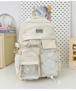 Vue détaillée du sac à dos scolaire crème avec poches multiples et filet latéral pratique