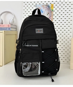 Détail du sac à dos ergonomique noir montrant des poches multiples et filetées