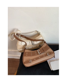 Close-up of vintage canvas saddle bags with retro metal buckle details and leather straps