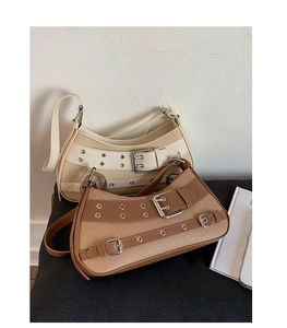 Detail of vintage canvas saddle bags with leather straps and metal buckle accents