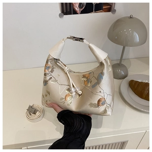 Detail of embroidered floral patterns and silk texture on a Chinese style shoulder bag