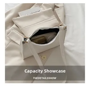 Interior view of white crocodile pattern baguette bag showing storage space and lining