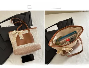 Macro shot of large woven straw tote bag with lace bow detail and brown leather pockets