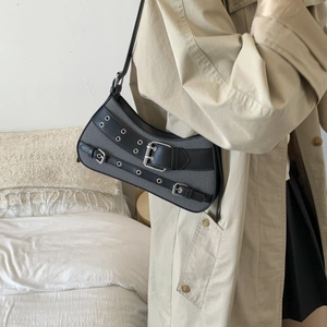 Retro punk saddle bag featuring gray fabric with black leather buckle straps and metal eyelets