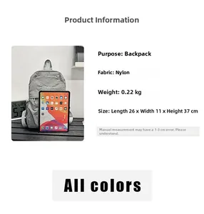 Grey nylon backpack size 26x11x37cm compared with a tablet for internal capacity