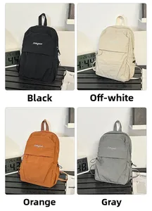 Detail view of four casual nylon backpacks in black, beige, orange, and grey colors