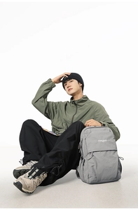 Macro shot of grey songuo backpack with durable nylon fabric and front zipper pocket