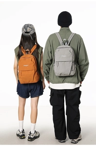 Detail of gray and orange lightweight backpacks with songuo branding and durable fabric