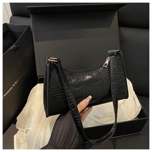 Elegant black crocodile texture underarm bag presented in a luxury gift box with silk lining