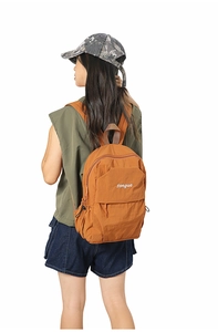 Close-up of the orange canvas backpack with songuo embroidery on the front pocket