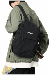 Side view of the black nylon backpack showing the songuo logo and textured fabric detail