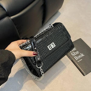 Glossy black crocodile pattern crossbody bag with silver lock and chain strap for women