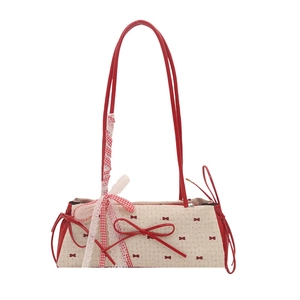 Sweet polka dot underarm bag with red bow and lace strap details for women