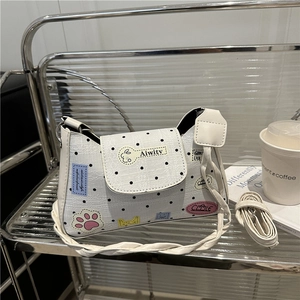 White leather polka dot tote bag with cartoon patches and adjustable shoulder strap