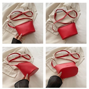 Detailed views of the red bucket bag showing pebbled leather texture and metal buckle