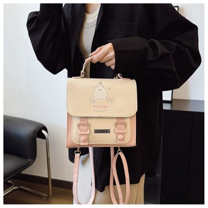 Detail of the pink and cream patchwork tote bag featuring cute cartoon bear pattern