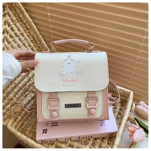 Detail of a pink and cream leather backpack with a cute bear print in a basket