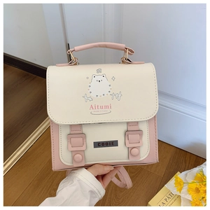 Detail of cute animal print backpack in pink and beige with Aitumi logo and metal buckle