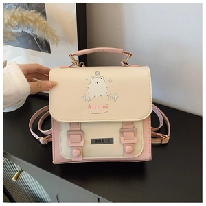 Detail of pink and white backpack featuring a cute bear print and buckle design