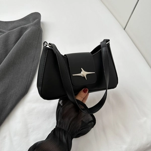 Chic black Y2K faux leather baguette bag with silver star buckle and shoulder strap