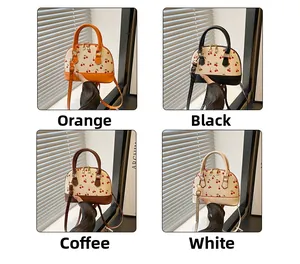 Shell shaped handbags with cherry prints shown in orange black brown and white colors