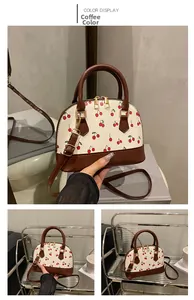 Detailed views of cherry print shell bag in cream and brown from multiple angles