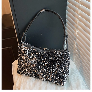 Detailed view of sequin shoulder bag with knot leather strap and metal zipper closure