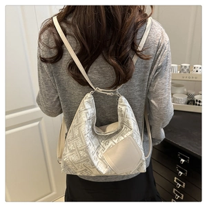 Detail showing grey geometric floral embroidery on a versatile Chinese style backpack