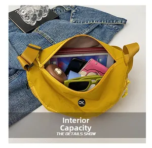 Inside view of yellow half-moon crossbody bag showing large capacity for essentials