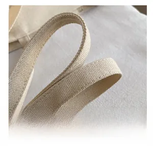 Close-up of thick woven canvas shoulder strap showing high-quality texture and durability