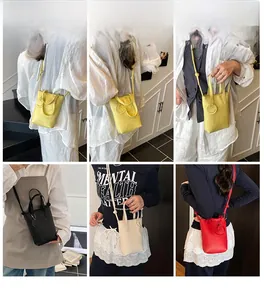 Collage of mini crossbody bags in yellow, black, beige, and red with smiley charms